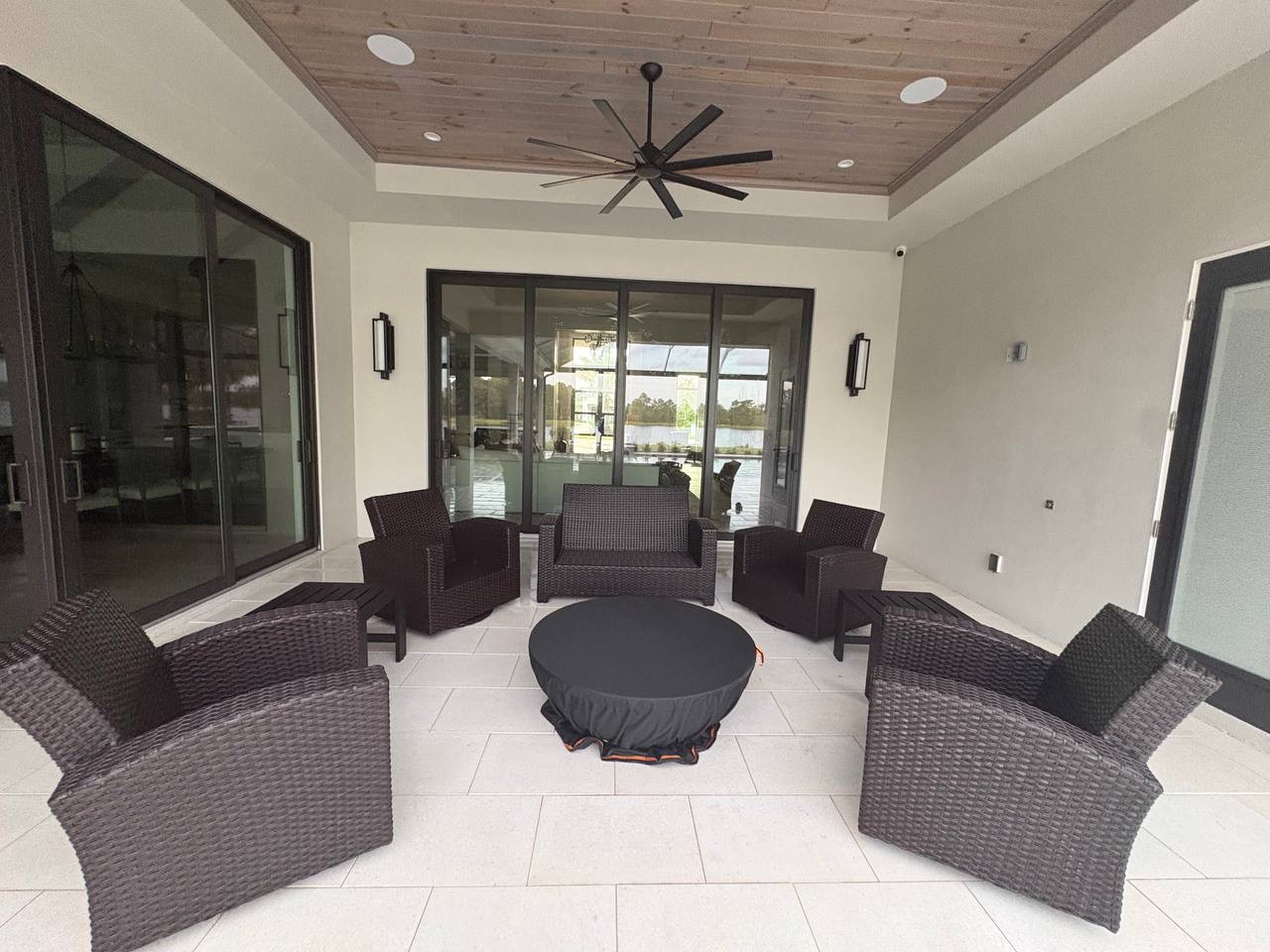 Finished covered patio with large clean sliding glass doors
